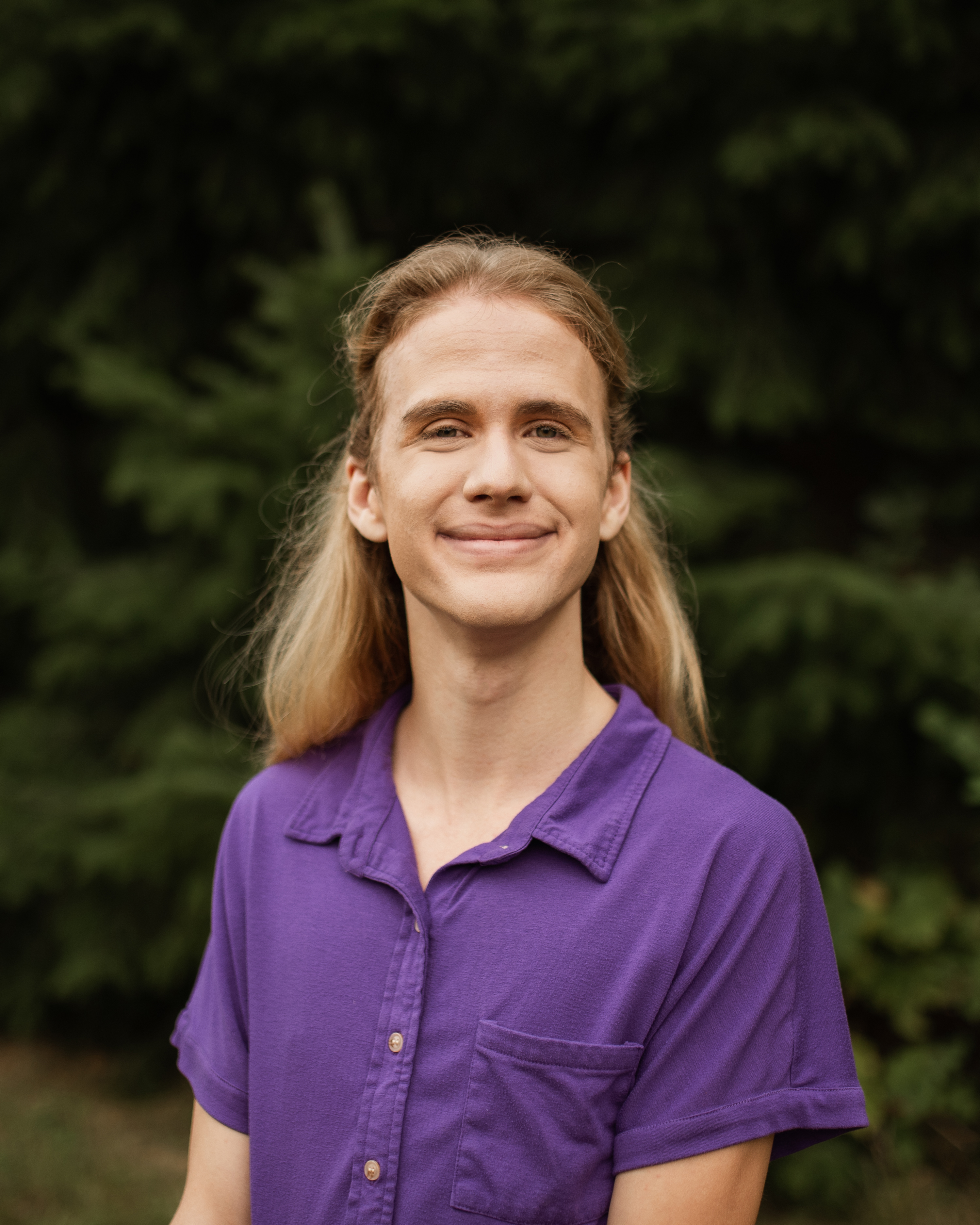 An image of Evan Leyden in a purple shirt.